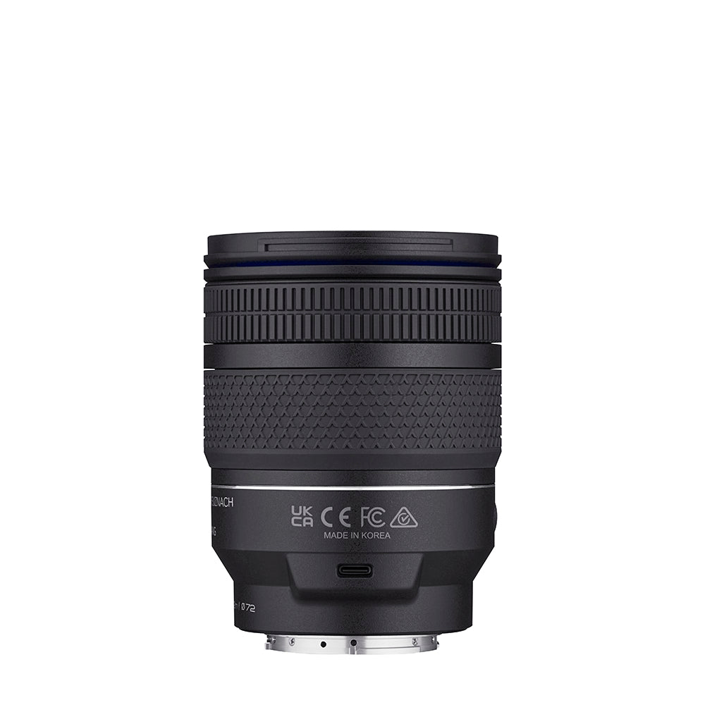 Black camera lens on a white background